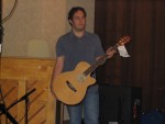 Arron holding the auction guitar